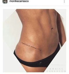 an image of a woman's stomach with the word love tattooed on her side