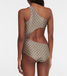 Find GUCCI Gg Cutout One-shoulder Swimsuit on Editorialist. Lining: 73% polyamide, fully lined, 27% elastane. Made in Italy. Material: 20% elastane, 80% polyamide. Designer color name: Beige/Ebony. Care instructions: hand wash. One Shoulder Stretch Cutout Swimwear, Gucci Swimsuit Bikinis, Gucci Fitted Summer Swimwear, Luxury One-shoulder Women's Swimwear, Fitted One-shoulder Cutout Swimwear, Poolside Sleeveless Cutout One-piece, Sleeveless Cutout One-piece Beachwear, Swimsuit Brands, One Shoulder Swimsuit