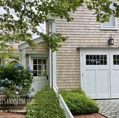 there is a house with two garage doors