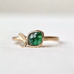 *Ethically Sourced raw Emerald, crafted with care and conscience for the conscious wearer. Each piece is handcrafted with Solid 14k/18k gold / platinum / silver in your choice. Specification: Item Type: Raw Gemstone Ring Materials: Raw Stone, Silver, Gold Main Stone: Raw Emerald Gem Color: Green *This is a listing for one handcrafted Emerald ring. We will carefully select a stone and make the piece for you. Please note that no two pieces are the same. Every raw stone is unique in size, shape and Raw Stone Engagement Rings Silver, Raw Emerald Engagement Ring, Unique Stone Engagement Rings, Green Stone Engagement Ring, Green Engagement Ring, Green Emerald Engagement Ring, Emerald Engagement Rings, Raw Stone Engagement Rings, Emerald Engagement Ring Green