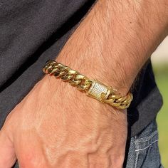 Men's Miami Cuban link chain bracelet 8.5" inches long and is 12MM thick. 14k gold plated finish over stainless steel. VVS D color moissanite on double latch lock. 14K GP 2ct VVS D stamped on the clasp. Double-sided clasp (stones on both sides of lock) Shows up as moissanite (not diamond) on lab assays. Second hardest to diamonds on the Mohs scale. Pass a diamond tester pen (as shown in photo) Nice and heavy weigh to it at approx. 62 grams. Real 925 silver bracelet won't turn your skin green. A Miami Cuban Link Chain, Diamond Tester, Miami Cuban Link, Mohs Scale, 925 Silver Bracelet, Miami Cuban, Chunky Bracelets, India Jewelry