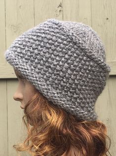 "This Handmade Knit Hat was created using a Seed Stitch, giving the final outcome a look and feel with texture.  This style hat has a flat top to the crown and fits snugly around the head. The brim of the hat is not too wide and does not roll up but down!  The Color, Style and Fit of this Winter Hat will make the perfect accessory to your fall or winter wardrobe! I used a chunky weight, premier yarn which is 100% Acrylic and the color used is Smoke Heather. To care for this knit hat, please Mach Knit Slouchy Hats, Knit Winter Hat, Yarn Ideas, Upcycle Sweater, Warm Winter Hats, Seed Stitch, Cloche Hat, Upcycled Denim, Winter Beanie