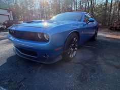 This vehicle is equipped with a HEMI 6.4L V8 engine that delivers an impressive 485 horsepower and 475 ft. lbs. of torque and is equipped with the 6-speed manual. The exterior of this model is finished in B-5 Blue color, while the interior is decked out in Red. With only 643 miles on the odometer, this Challenger is practically brand new. Davis4x4.com