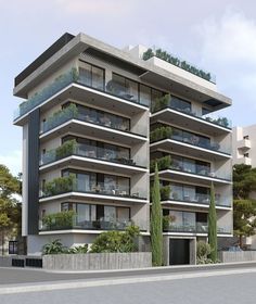 an apartment building with balconies and plants on the balconies is shown