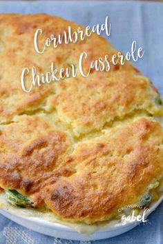 a close up of a casserole on a plate with the words cornbread chicken casserole