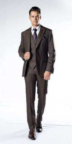 The Collins Brown Tweed Slim Fit Suit This Brown Tweed Three Piece Suit has been designed to reignite your tweed suit collection. This tweed suit consists of a light luxurious tweed. it has contemporary style with a modern and dapper fit. Perfect for all occasion and any individual with a quirky sense of style. Jacket: 2 Button Closure, Wide peak lapel, Single vent, Jetted/Flap pocket, Ticket pocket, Brown/Ivory button cuff Waistcoat: Relaxed fit, Traditional 5 button, Pointed tips, Jacquard bac Brown Three Piece Suit, Three Piece Suit Wedding, Brown Tweed Suit, Tweed Waistcoat, Tweed Suit, Suit Collection, Clothing Guide, Brown Tweed, Herringbone Tweed