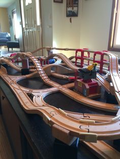 a toy train set on top of a wooden table