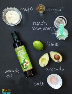 ingredients for an avocado smoothie laid out on a chalkboard