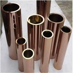 several different sizes and shapes of copper pipes