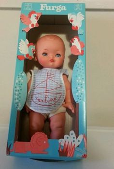 a baby doll in a box with an open tag on it's chest that says furga