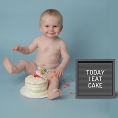 a baby sitting in front of a cake with the words today i eat cake on it