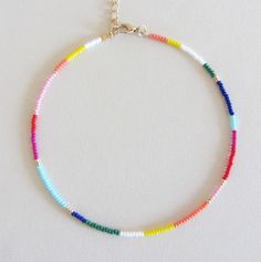 Beaded choker rainbow bead choker choker necklace hippie colorful choker boho chokers seed bead choker colorful beaded choker beach jewelry  These are multi-colored, opaque shiny beads of size 10/0. Please choose the length of the necklace clasp color from the drop down menu or request any length. Each necklace has a 2 inch extension chain. Summer Spacer Bead Choker Jewelry, Summer Bohemian Beaded Chain Choker, Bohemian Choker Beads For Summer, Bohemian Bead Choker For Summer, Bohemian Rainbow Beaded Bracelets For Summer, Adjustable Rainbow Beaded Choker Necklaces, Trendy Rainbow Beaded Necklaces, Bohemian Rainbow Choker Necklace, Bohemian Summer Bead Choker