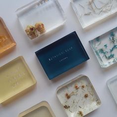 nine square trays filled with different types of soap