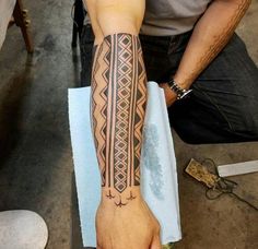 a man with a tattoo on his arm