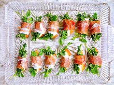 a glass platter filled with lots of food