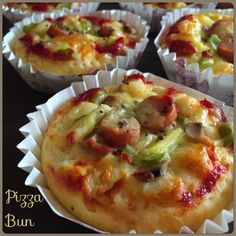 several small pizzas with different toppings in paper cups