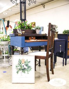 an assortment of furniture and decor items in a room with a chandelier hanging from the ceiling