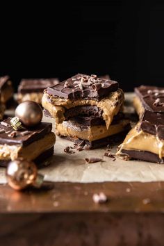 chocolate and peanut butter squares are stacked on top of each other