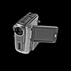 an image of a camera that is attached to the side of a cell phone holder