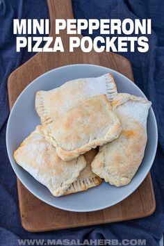 mini pepperoni pizza pockets on a plate with text overlay that reads mini pepperoni pizza pockets