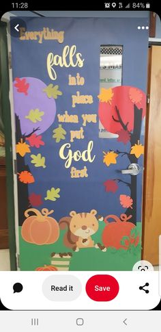 a door decorated with fall leaves and an image of a lion in the forest on it