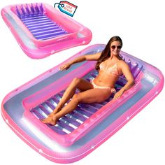 a woman laying on top of an inflatable pool with sunbathing pad