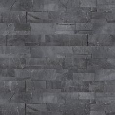 an image of a stone wall that looks like it is made out of slate