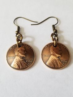 "Celebrate 65 years in 2021 with earrings made with genuine 1956 US pennies. A fun and unique way to  say \"Happy 65th to those born in 1956. I buff them to bring out the design on the dark antique patina I domed and polish each penny and link them to ear wires. I apply a clear metal coating to the pennies to maintain the color and  shine. You can choose any year you want." Retro Brown Jewelry For Gift, Vintage Jewelry With Ear Wire For Anniversary, Vintage Nickel-free Jewelry For Anniversary, Retro Nickel Free Jewelry For Gifts, Retro Nickel-free Drop Earrings, Nickel-free Retro Drop Earrings, Retro Drop Earrings Jewelry Gift, Vintage Hypoallergenic Jewelry For Gift, Hypoallergenic Vintage Jewelry For Gift