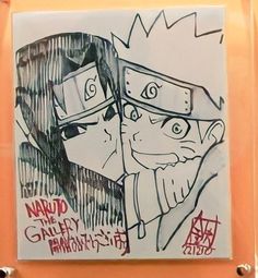 a drawing of naruto and sashika on a glass block in front of an orange wall