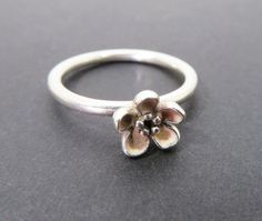 A pretty sterling silver ring with a single raised flower with light pink enamel. Marked S925 ALE 54 inside, which shows it is a Pandora ring. Striking on its own or as a stackable ring. Good condition. Measurements: UK size N / USA 6.5. Weighs 2.4. All postage is tracked to ensure safe arrival, free to UK buyers. I combine postage wherever possible. For more items of interest please visit https://www.etsy.com/shop/BlueGatto Pandora Flower Ring, Pandora Flower, Pandora Ring, Pandora Rings, Pink Enamel, Stackable Ring, Flower Ring, Stackable Rings, Rings Statement