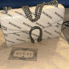 Calfskin Double Silver Strap Snake Silver Clasp. Gucci & Balenciaga Collaboration 2021. Purchased In Paris, France Gucci. 100% Authentic White Shoulder Bag For Evening With Original Box, White Leather Gucci Shoulder Bag, Elegant Gucci Shoulder Bag With Logo, White Gucci Shoulder Bag With Chain Strap, White Logo Shoulder Bag For Formal Occasions, Formal White Shoulder Bag With Logo, White Luxury Gucci Shoulder Bag, White Gucci Shoulder Bag For Evening, Luxury White Gucci Shoulder Bag