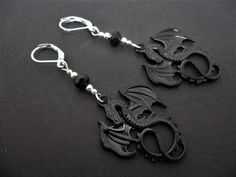 This is a pair of pretty dangly tibetan silver black dragon themed leverback hook earrings. Measure approx. 6cm long. With silver plated hooks and findings. Thanks for looking!! Black Jewelry With Dragon Design For Gift, Black Dragon Design Jewelry Gift, Black Dragon, Dangly Earrings, Jade Beads, Hook Earrings, Beautiful Earrings, Pretty In Pink, Favorite Jewelry