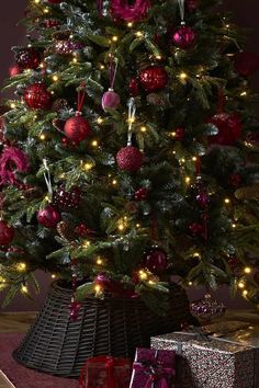 a decorated christmas tree with presents under it