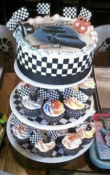 a three tiered cake with cupcakes on the bottom and checkerboard design