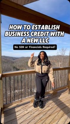 a woman standing on top of a wooden deck next to a railing with the words how to establishment business credit with a new lic