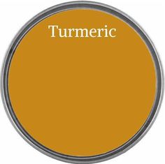 a yellow tin with the word turmric in white lettering on it and an orange circle