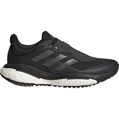 the adidas running shoe is black with white soles and an upper - cut outs