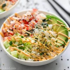 two bowls filled with different types of food