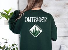 Outsider Sweatshirt | Evergreen Sweatshirt | Camping Lover Gift *I am able to put this design on other products such as sweatshirts and tote bags etc. Please message me if you would like this design on a different product.  ** Also available in children's sizes. Please message me. This product is printed in the UK and is intended to be shipped to the UK & Europe. If you are in the United States, Canada or any other country; please message me. I may be able to have it printed in your home country Green Crew Neck Sweatshirt For Outdoor, Green Relaxed Fit Sweatshirt For Outdoor Activities, Green Relaxed Fit Sweatshirt For Outdoor, Camping Lovers, Outdoor Enthusiast, Evergreen Trees, Gifts For Nature Lovers, Unisex Shirt, Nature Lover