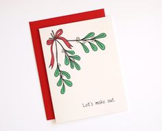 a red and green christmas card with the words let's make out on it