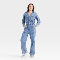 Embrace laid-back style with this Long-Sleeve Utility Baggy Denim Jumpsuit from Universal Thread™. Made of cotton and lyocell, this long-sleeve jumpsuit features a collared neckline with button-down style. This straight-leg jumpsuit comes with a fly button and zipper for a snug, stay-put fit. Designed with barrel cuffs, this jumpsuit sports two front pockets, two side pockets and two back pockets. Universal Thread™: Found exclusively at Target. Fall Light Wash Jumpsuits And Rompers With Pockets, Medium Wash Cotton Denim Jumpsuit For Fall, Fall Medium Wash Cotton Denim Jumpsuit, Cotton Denim Jumpsuit In Medium Wash For Fall, Relaxed Fit Long Sleeve Denim Jumpsuit, Fall Workwear Light Wash Denim Jumpsuit, Fall Light Wash Denim Jumpsuit With Pockets, Casual Fall Denim Jumpsuit In Medium Wash, Fall Light Wash Denim Jumpsuit For Work