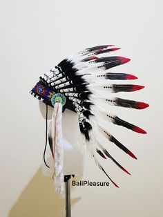 White Black & Red Feather Indian HeaddressThis Headdress is 100% handmade from Feathers and Leather.* Head circumference: 59 centimeters / 23 inches* Length : Short* Please input your phone number for shipment inquiry---------------------SHIPPING INFO- Standard Shipping : Estimated around 7-15 business days.- Express Shipping : Estimated around 3-5 business days.* Canada shipment will using Express Shipping with 3-5 business days delivery.* Shipping upgrades available when checkout.* We provide Traditional Black Costume Hats And Headpieces For Festivals, Traditional Black Costume Hats For Festivals, Traditional Handmade Black Hat Bands, Adjustable Multicolor Costume Hats And Headpieces, Traditional Black Hat Bands For Festival, Ceremonial Black Adjustable Headpieces, Traditional White Hat Bands For Festival, Adjustable Black Ceremonial Headpiece, Adjustable Red Hat For Carnival