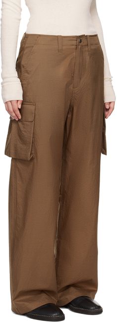 Lightweight nylon ripstop cargo pants. · Belt loops · Three-pocket styling · Zip-fly · Bellows pockets Supplier color: Golden brown Jamavar Pants, Red Cargo Pants, Our Legacy, Brown Plaid, Bellows, Cargo Pants Women, Plaid Pants, Golden Brown, Black Canvas