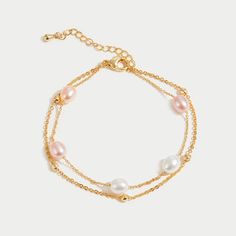 Discover the stunning beauty of real freshwater pearls with this layered bracelet. With beautiful shades of ivory and delicate pink, this bracelet will definitely elevate any outfit. 18K gold plated Freshwater pearl Length: 6.1in (+ 1.8in adjustable) Lobster clasp closure Hypoallergenic, lead & nickel free If you a Elegant Pink Gold-plated Bracelets, Pink Gold Plated Bracelets, Rose Gold Pearl Bracelets With Pearl Chain, Feminine Pearl Drop Bracelets, Adjustable Pink Pearl Bracelet With Pearl Drop, Feminine Gold Bracelet With Pearl Charm, Feminine Gold Bracelets With Pearl Charm, Elegant Pink Bracelets With Pearl Chain, Pink Pearl Drop Bracelet