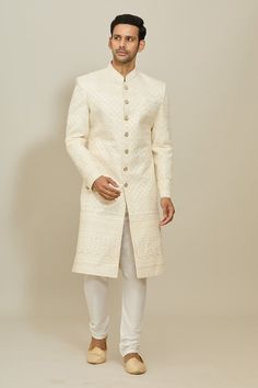 Cream sherwani featuring thread and sequin work all over. Paired with a white churidar. - Aza Fashions White Churidar With Intricate Embroidery For Festive Occasions, Festive White Churidar With Intricate Embroidery, Festive Designer Sherwani With Chikankari Embroidery, Unstitched Embroidered Off White Bandhgala, Ceremonial Off-white Bandhgala With Intricate Embroidery, Ceremonial Off White Bandhgala With Intricate Embroidery, Ceremonial White Raw Silk Kurta, Off White Bandhgala For Festive Occasions, Traditional White Bandhgala For Festive Occasions