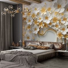 a bedroom with large white and gold flowers on the wall above the bed, along with chandelier