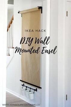 a wall mounted easel with the words ikea hack dry wall mounted easel