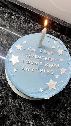 a birthday cake with a lit candle on it