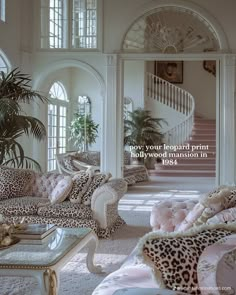 a living room filled with lots of furniture next to a stair case on the wall