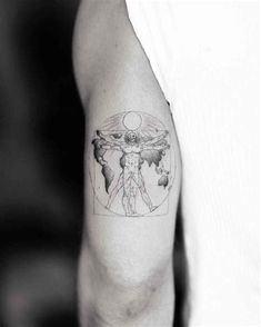 a man's arm with a tattoo on it that has an image of the person holding